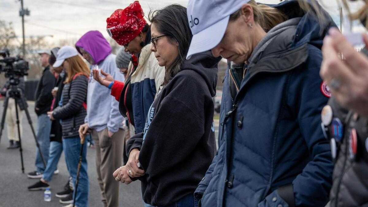 Community members attend a vigil on Monday in Kansas City to remember the victims of last week’s mass shooting after the Kansas City Chiefs Super Bowl victory rally at Union Station. The vigil was organized by KC Mothers in Charge.