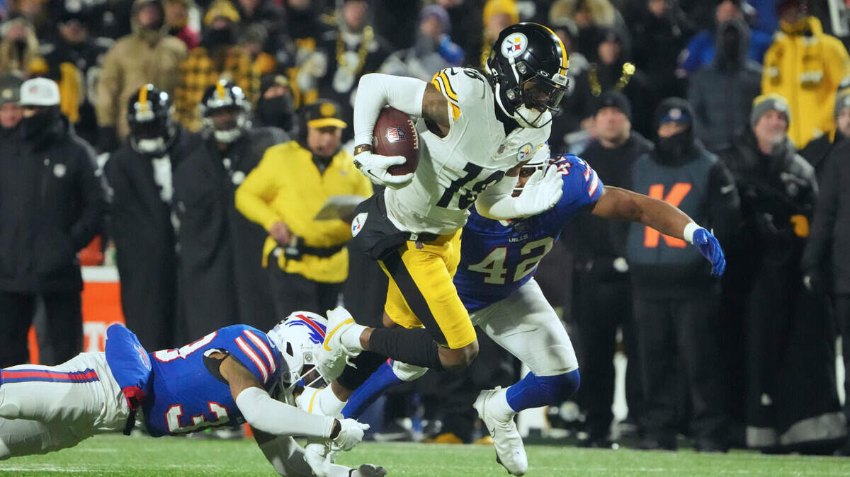 Buffalo Bills cornerback Cam Lewis attempted to tackle Pittsburgh Steelers wide receiver Diontae Johnson in the second half in the second half in a 2024 AFC Wild Card game at Highmark Stadium.