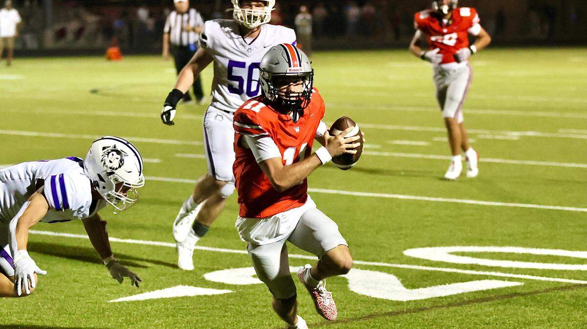 Quarterback Tate Nagy scrambles to help Blue Valley West to a 42-35 win over Blue Valley Northwest in high school football action on Friday night.