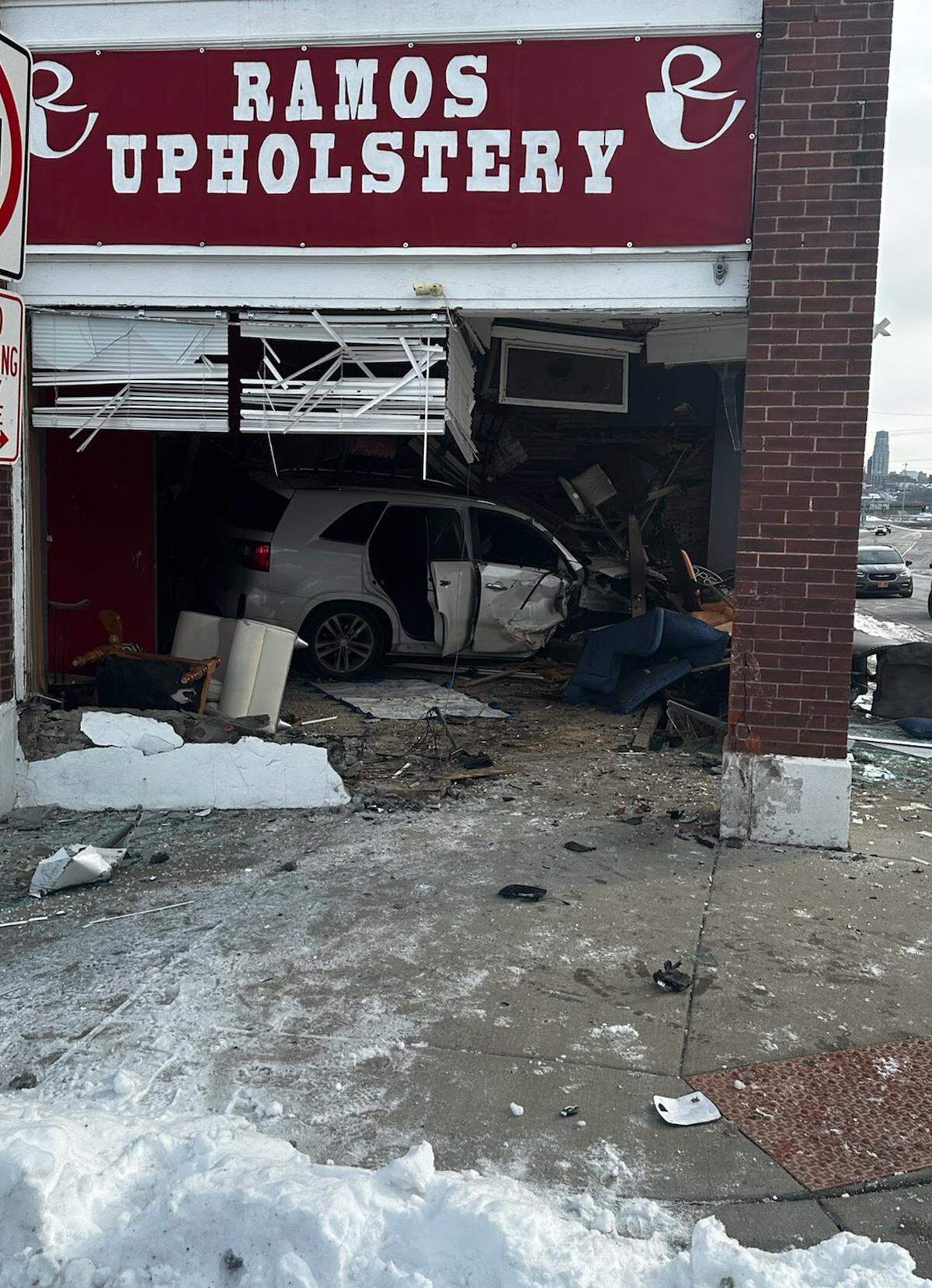 An SUV crashed through the window and into the shop of Ramos Upholstery shortly after 9:15 a.m. Thursday, according to Kansas City, Kansas, police. No one was inside the shop, located at the corner of Central Avenue and North Tremont Street in the Strawberry Hill neighborhood, at the time of the crash. The driver suffered critical injuries.