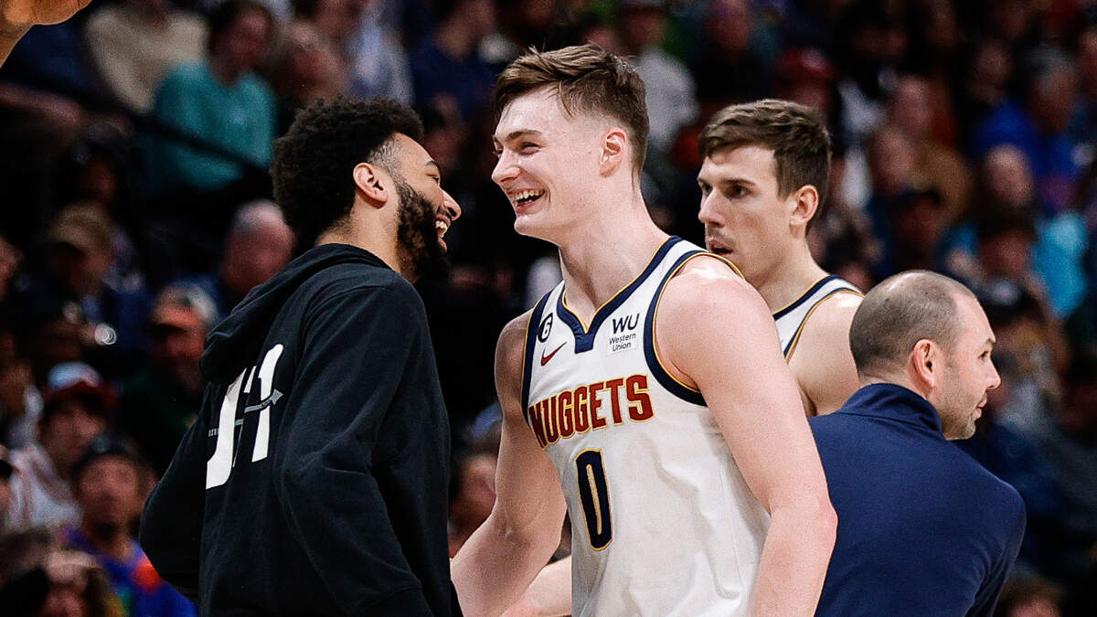 Denver Nuggets guard Christian Braun (0) reacts with guard Jamal Murray (27) after a play in the third quarter against the Memphis Grizzlies at Ball Arena on December 20, 2022.