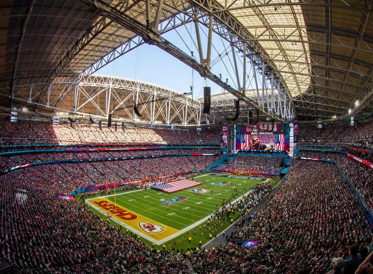 Fans stand in a packed State Farm Stadium for the National Anthem during Super Bowl LVII on Sunday, Feb. 12, 2023, in Glendale, Ariz.