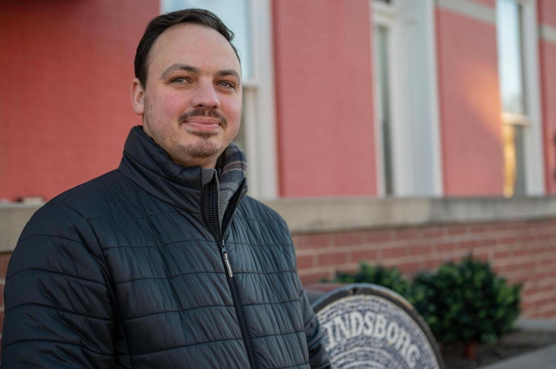 Lindsborg’s community development director, Jordan Jerkovich, stands in front of City Hall. At 29, Jerkovich is among a younger generation of city leaders who have taken positions in recent years.