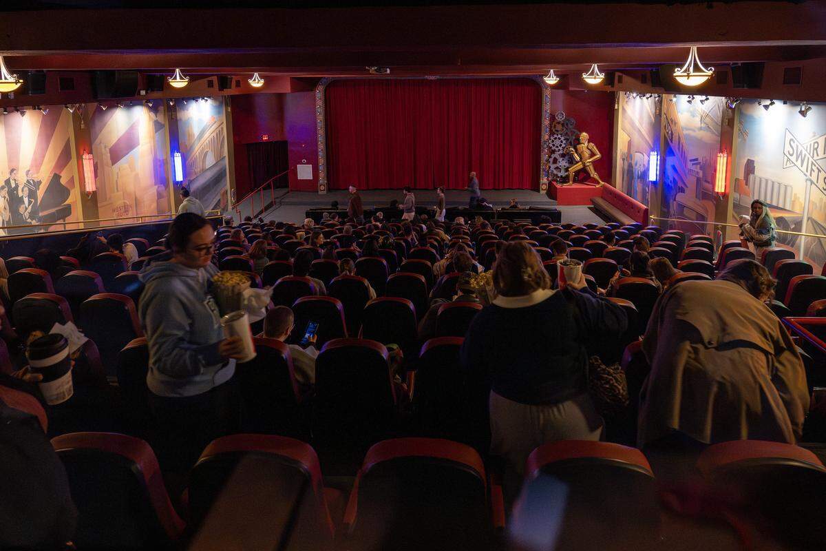 People attend a 70mm screening of “Sinners” at Screenland Armour Theatre on Friday, March 27, 2026, in North Kansas City.