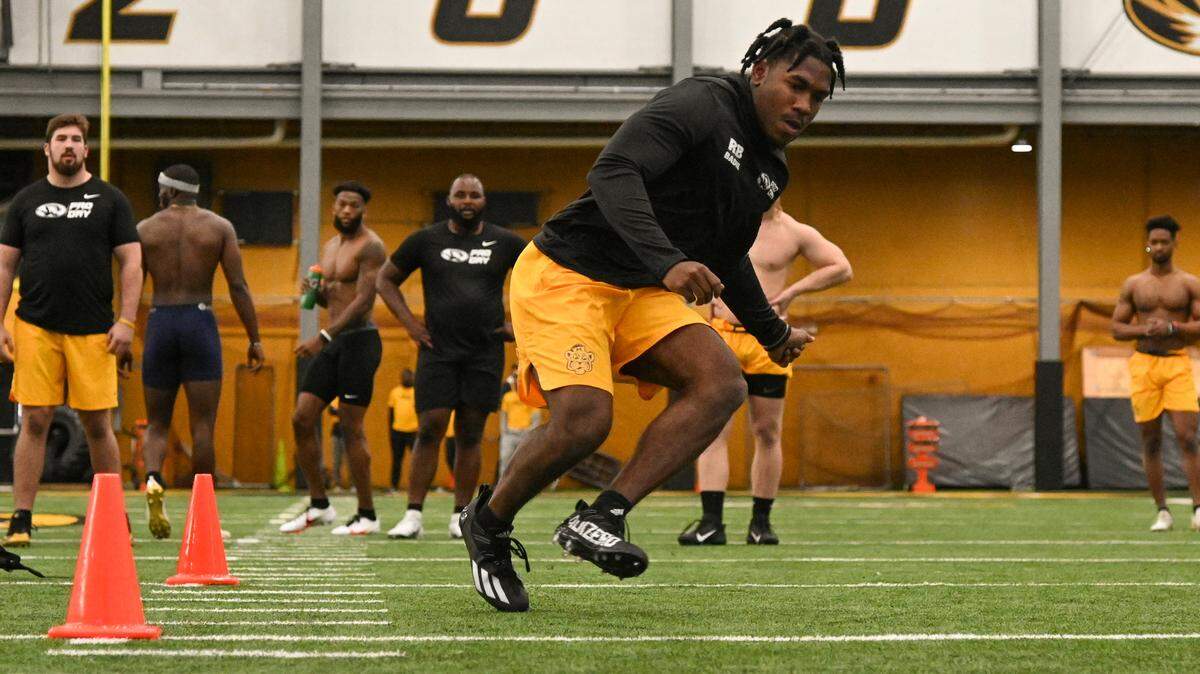 Missouri Tigers running back Tyler Badie, drafted on Saturday by the Baltimore Ravens, goes through a drill during Mizzou’s Pro Day in front of NFL scouts last month in Columbia.