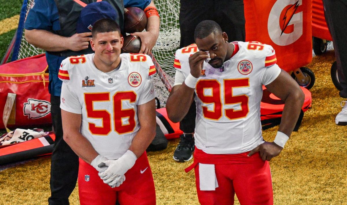 Kansas City Chiefs defensive tackle Chris Jones wipes tears from his eyes while standing next to defensive end George Karlaftis during the national anthem before the start of Super Bowl LIX on Sunday, Feb. 9, 2025, in New Orleans.
