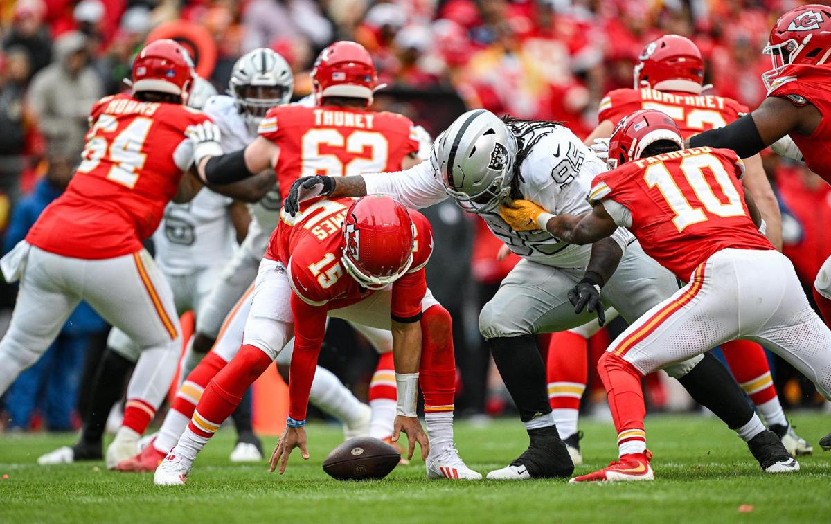 A fumble by Kansas City Chiefs quarterback Patrick Mahomes (15) in the second quarter was recovered by the Las Vegas Raiders and carried in for a touchdown Monday, Dec. 25, 2023, at GEHA Field at Arrowhead Stadium.