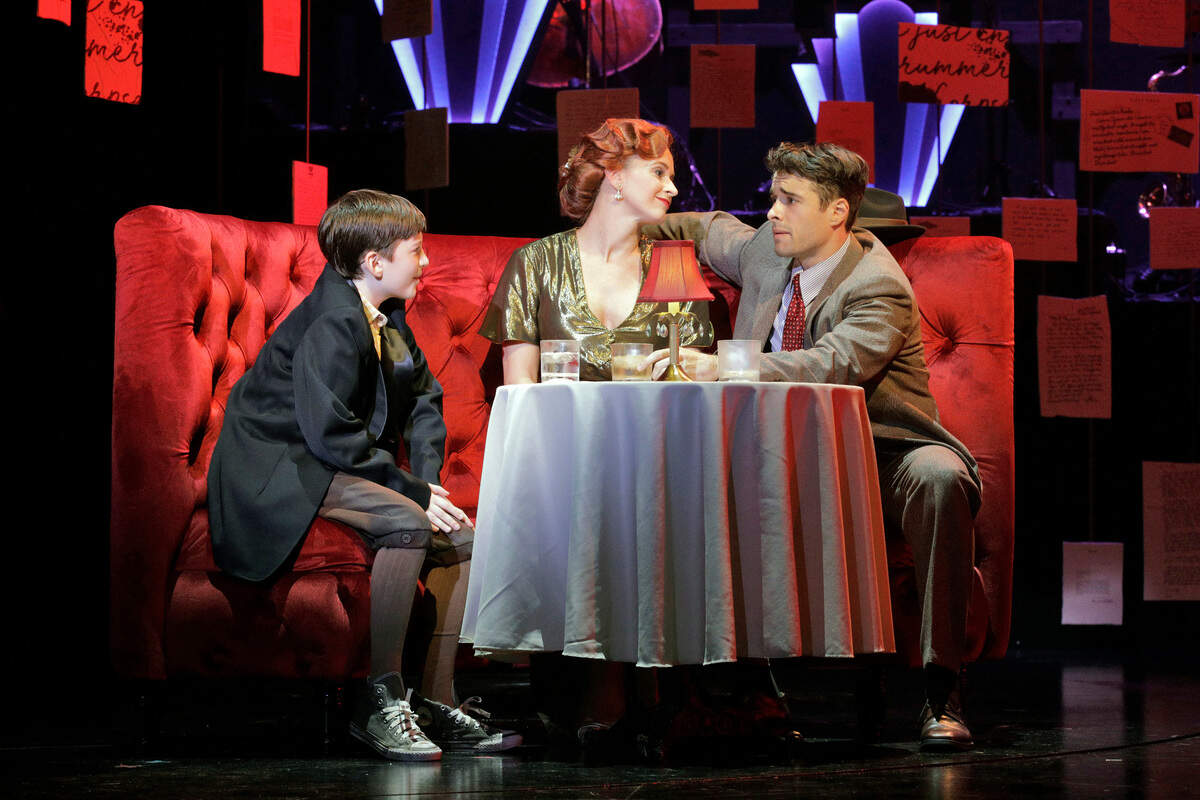 Joey (Robbie Berson, left) gets to know his idol, New York Giants third baseman Charlie Banks (Corey Cott), and Charlie’s girlfriend, a nightclub singer (Emily Padgett).