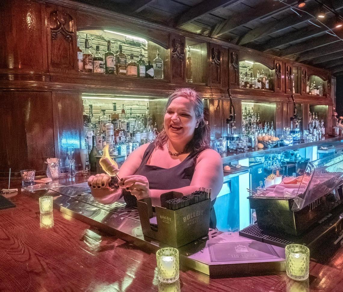 Barkeep Maggie McReynolds ignited marshmallows as embellishment for a specialty drink at The Forge.