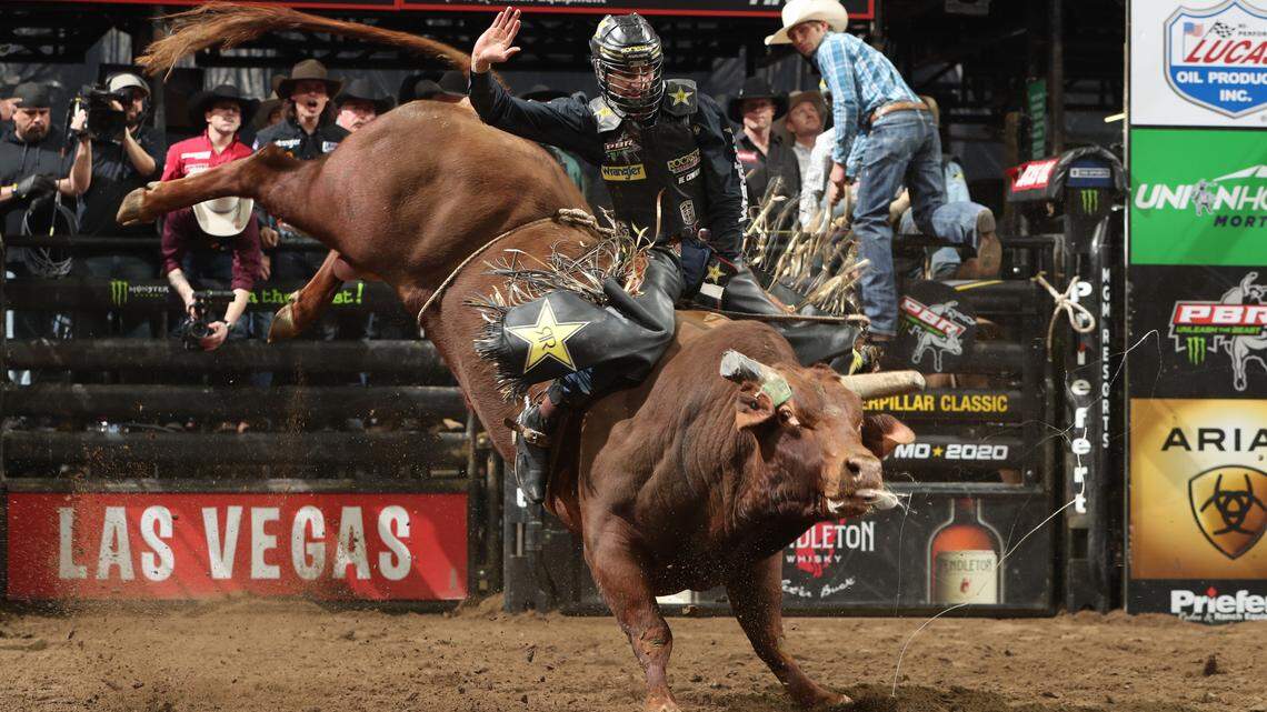 A bull rider goes airborne during the first round of the Kansas City Unleash The Beast PBR event Saturday at Sprint Center.