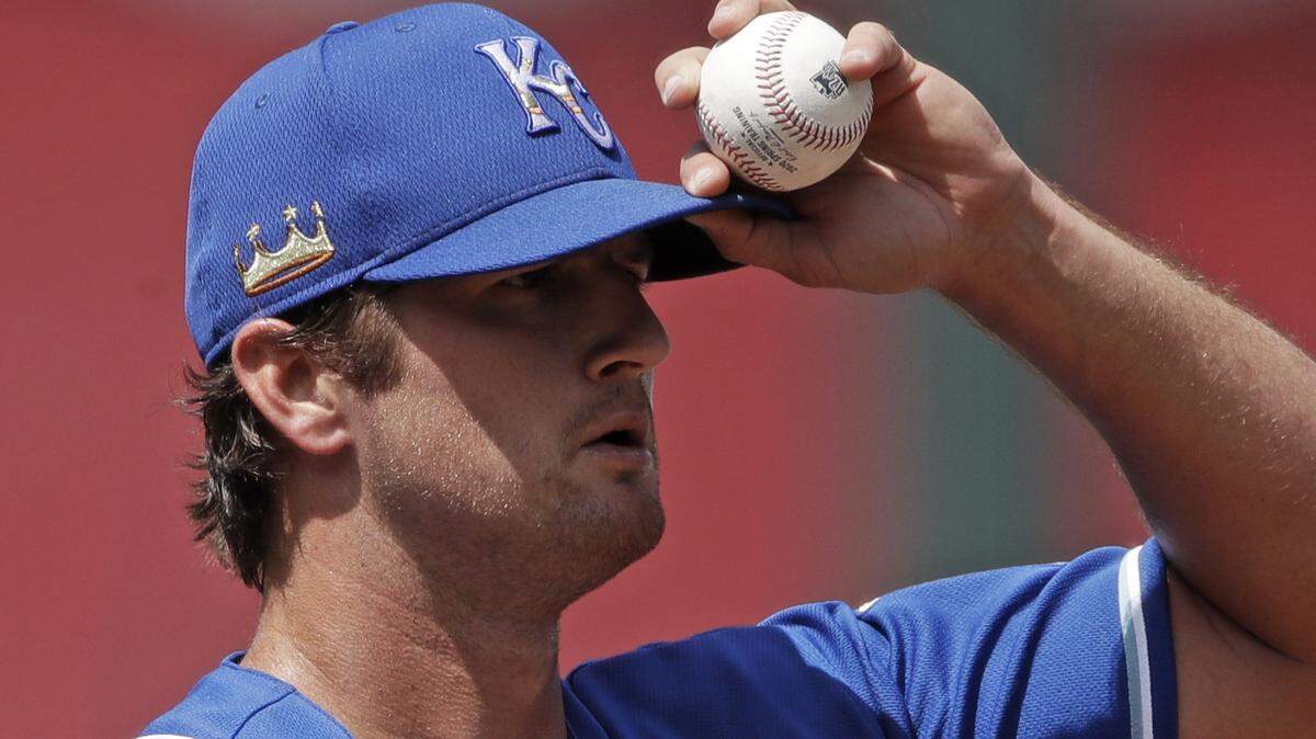 Kansas City Royals pitcher Foster Griffin gets ready to throw during baseball practice at Kauffman Stadium on Thursday, July 9, 2020, in Kansas City, Mo. (AP Photo/Charlie Riedel)