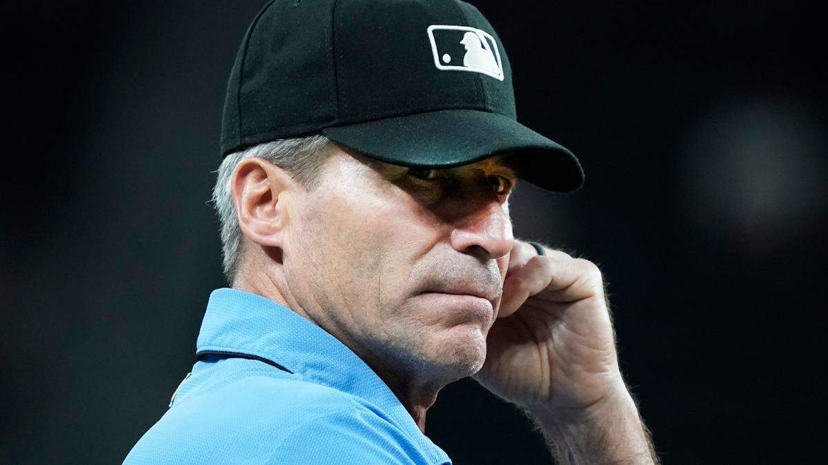 Umpire Angel Hernandez (5) works at third base during a game between the Texas Rangers and the Houston Astros at Globe Life Field.