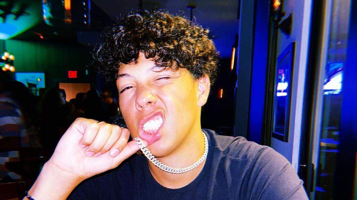 Surveillance video shows Jackson Mahomes grabbing Aspen Vaughn by the throat and kissing her at least twice in her office.