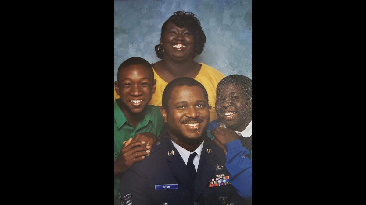 Anthony Guthrie (middle) with his family