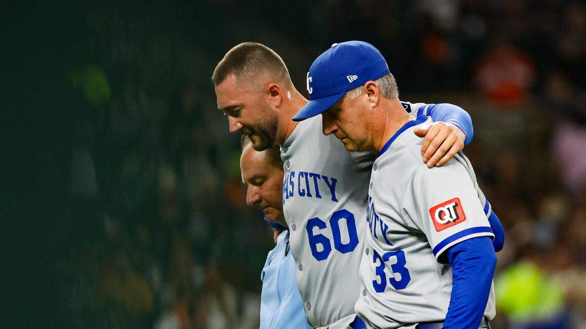 Kansas City Royals pitcher Lucas Erceg (60) is helped off the field by manager Matt Quatraro (33) and training staff during the seventh inning against the Detroit Tigers at Comerica Park on April 18, 2025.