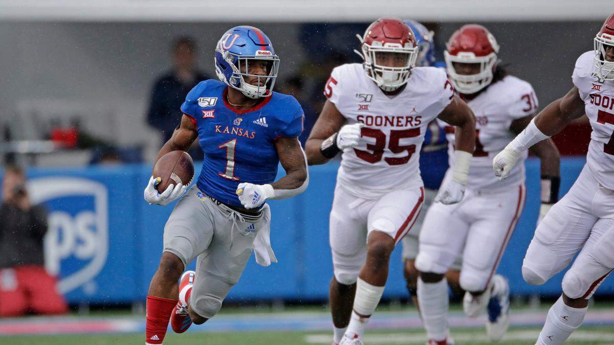 Pooka Williams (left) ran for good yardage in a KU game vs. Oklahoma.
