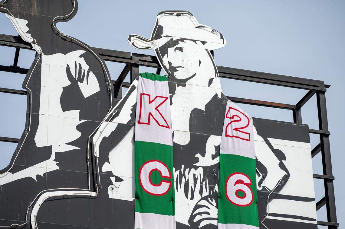 A PBR Big Sky cowgirl figures is seen wrapped in a custom-knit scarf at the Kansas City Power & Light District on Sunday, March 1, 2026.