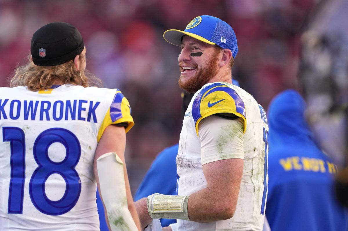 Los Angeles Rams quarterback Carson Wentz (right) talks with wide receiver Ben Skowronek (18) during the fourth quarter against the San Francisco 49ers at Levi’s Stadium on Jan. 7, 2024.