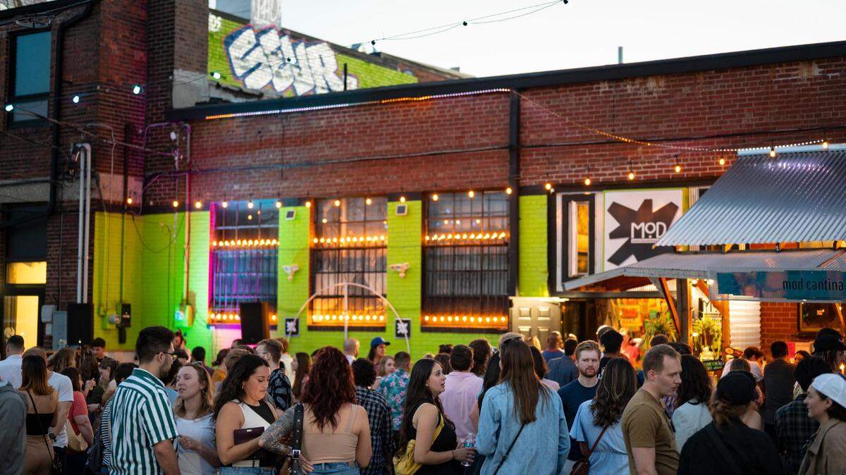 People line up at Mod Cantina during the First Fridays celebration in Kansas City’s Crossroads Art District on June 3, 2022.