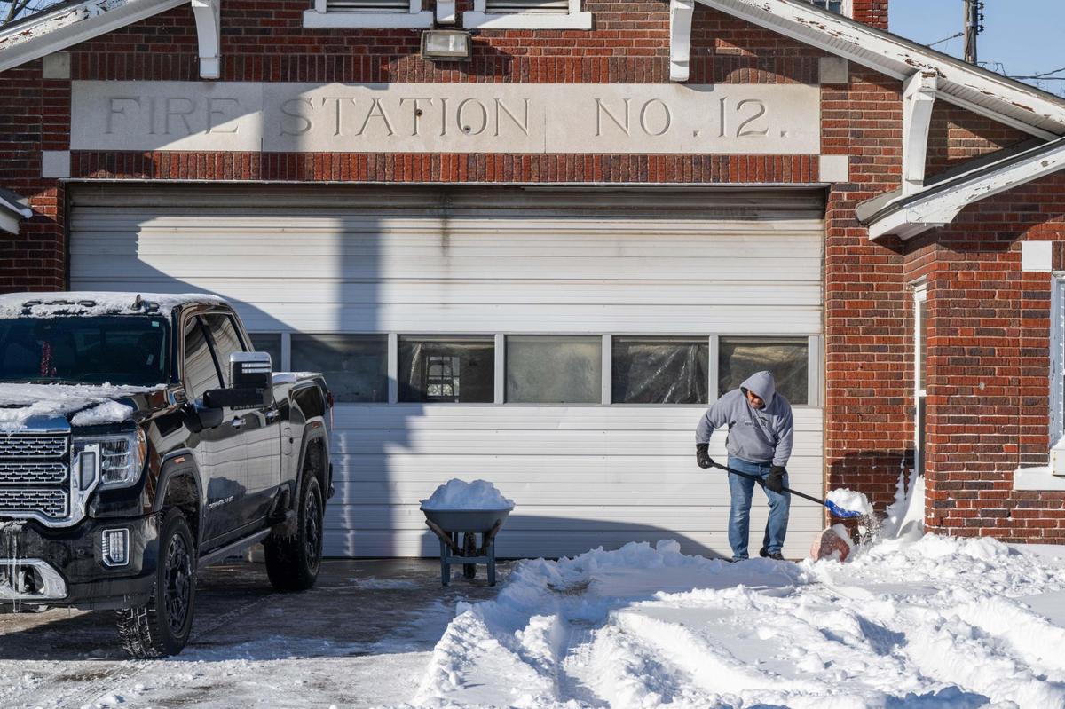Gary Tapusoa shovels snow outside his apartment on Rainbow Boulevard in Kansas City on Monday, Jan. 6, 2025. The Kansas City metro area received record snowfall the day before.