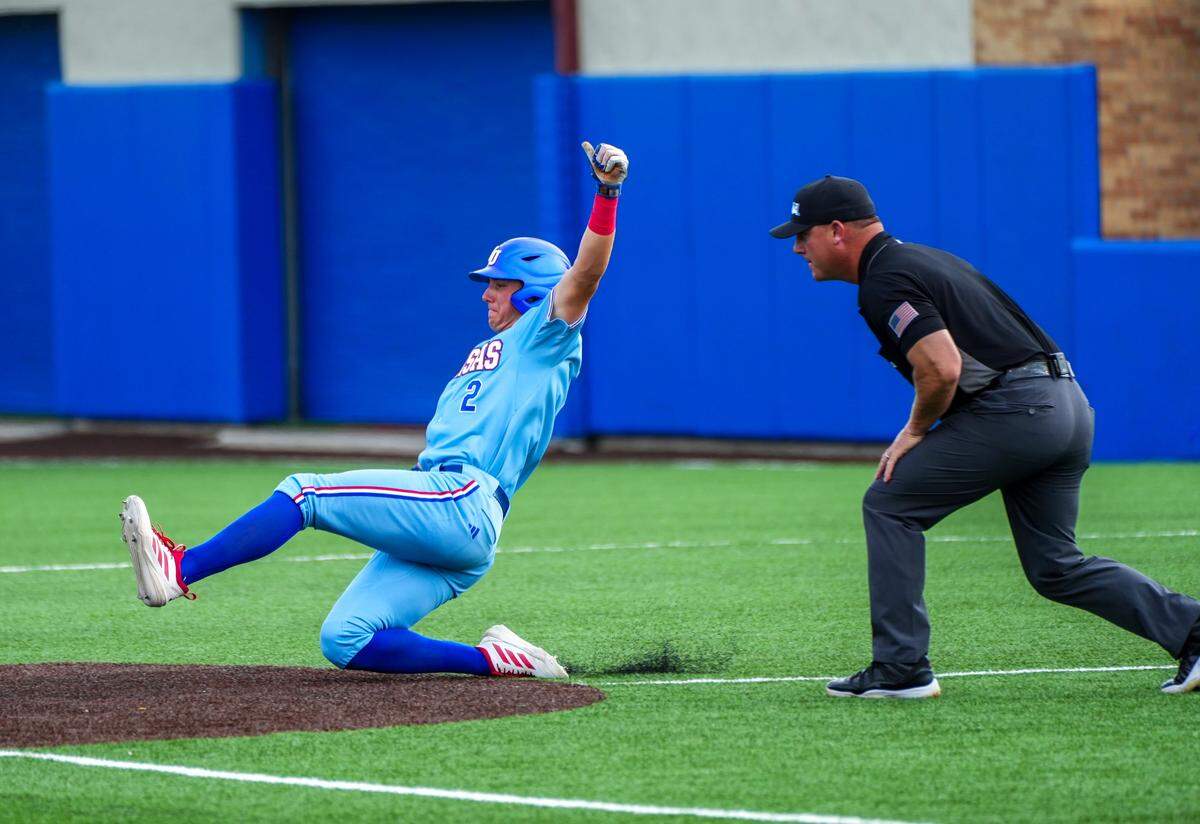 Kansas Jayhawks shortstop Tyson LeBlanc (2) slides during the NCAA baseball regionals against the Arkansas Razorbacks at Hoglund Ballpark in Lawrence, Kansas, on Sunday, May 31, 2026.