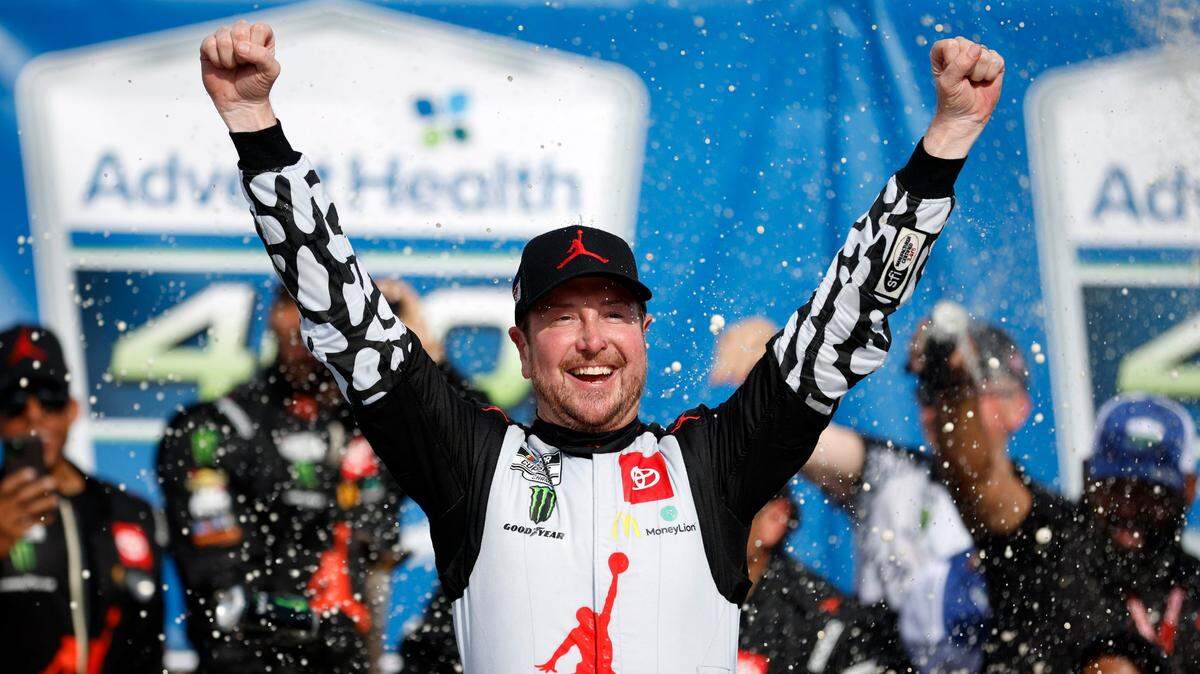 Kurt Busch celebrates in Victory Lane after winning the AdventHealth 400 NASCAR Cup Series auto race at Kansas Speedway in Kansas City, Kansas on Sunday.