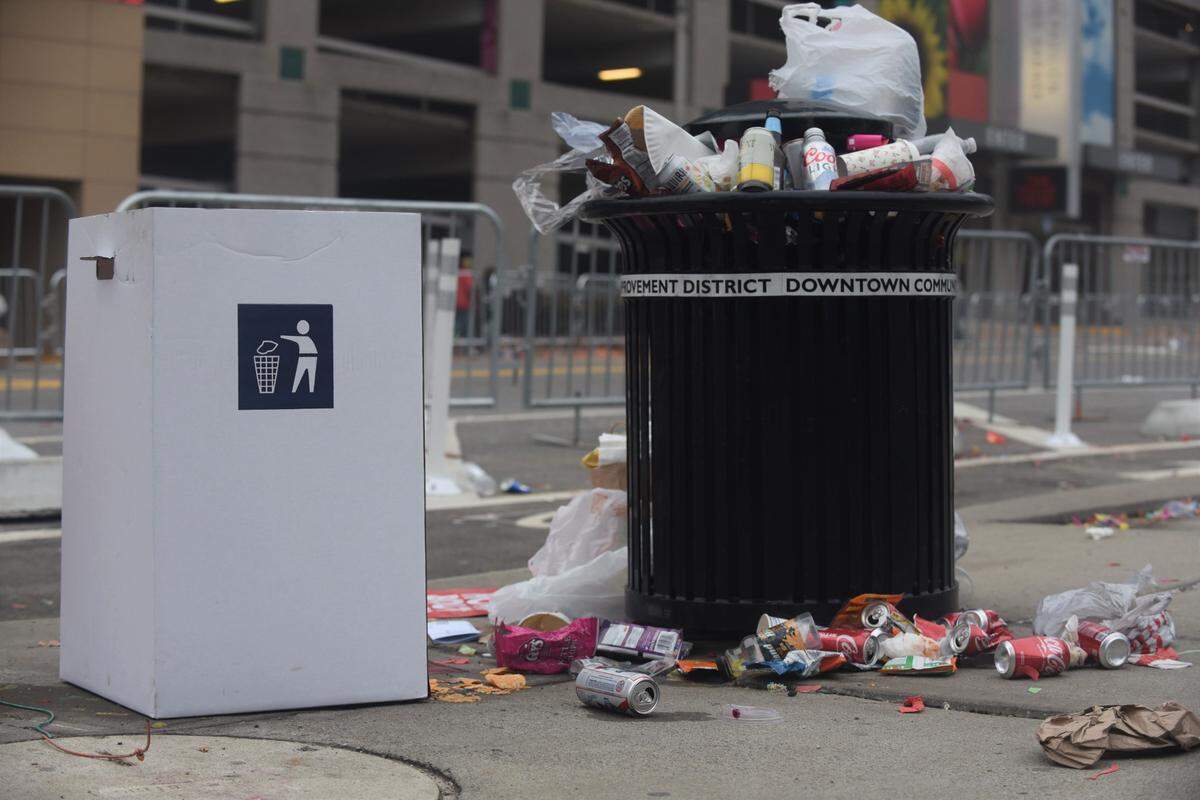 Trash was piled up along Grand Boulevard on Wednesday following the Chiefs Super Bowl victory parade.