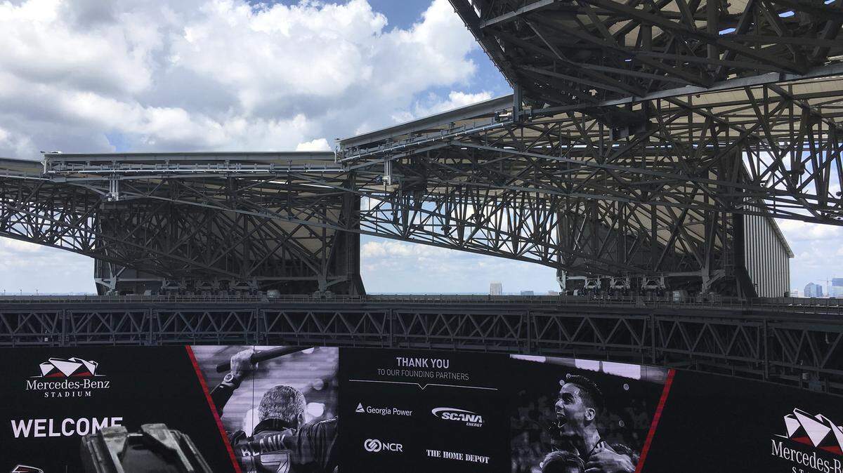 Blue sky and sunshine are seen through the roof of the Mercedes-Benz Stadium after the roof was opened during a demonstration for the media Wednesday, July 25, 2018, in Atlanta. The roof was closed for most of the 2017 NFL season due to design problems and now can be opened and closed in minutes.