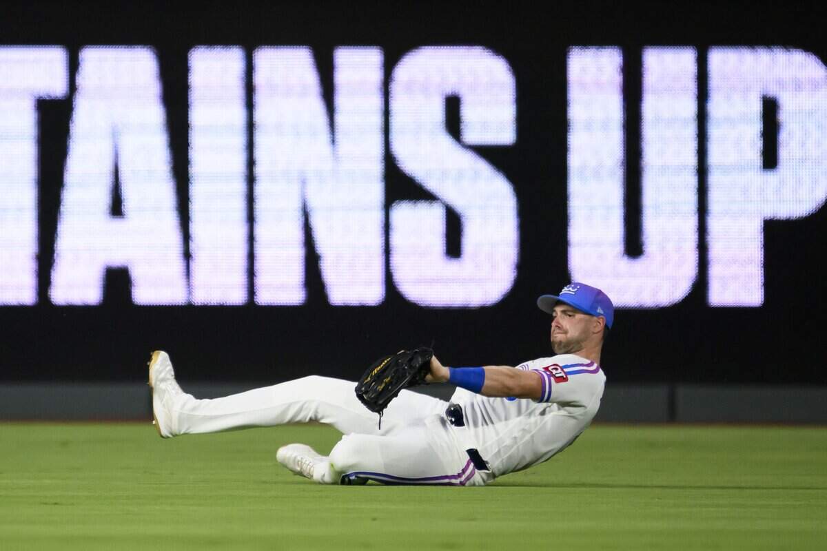 KANSAS CITY, MISSOURI - JULY 17: Lane Thomas of the Kansas City Royals makes a sliding catch for an out during the sixth inning at Kauffman Stadium on July 17, 2026 in Kansas City, Missouri. (Photo by Reed Hoffmann/Getty Images)