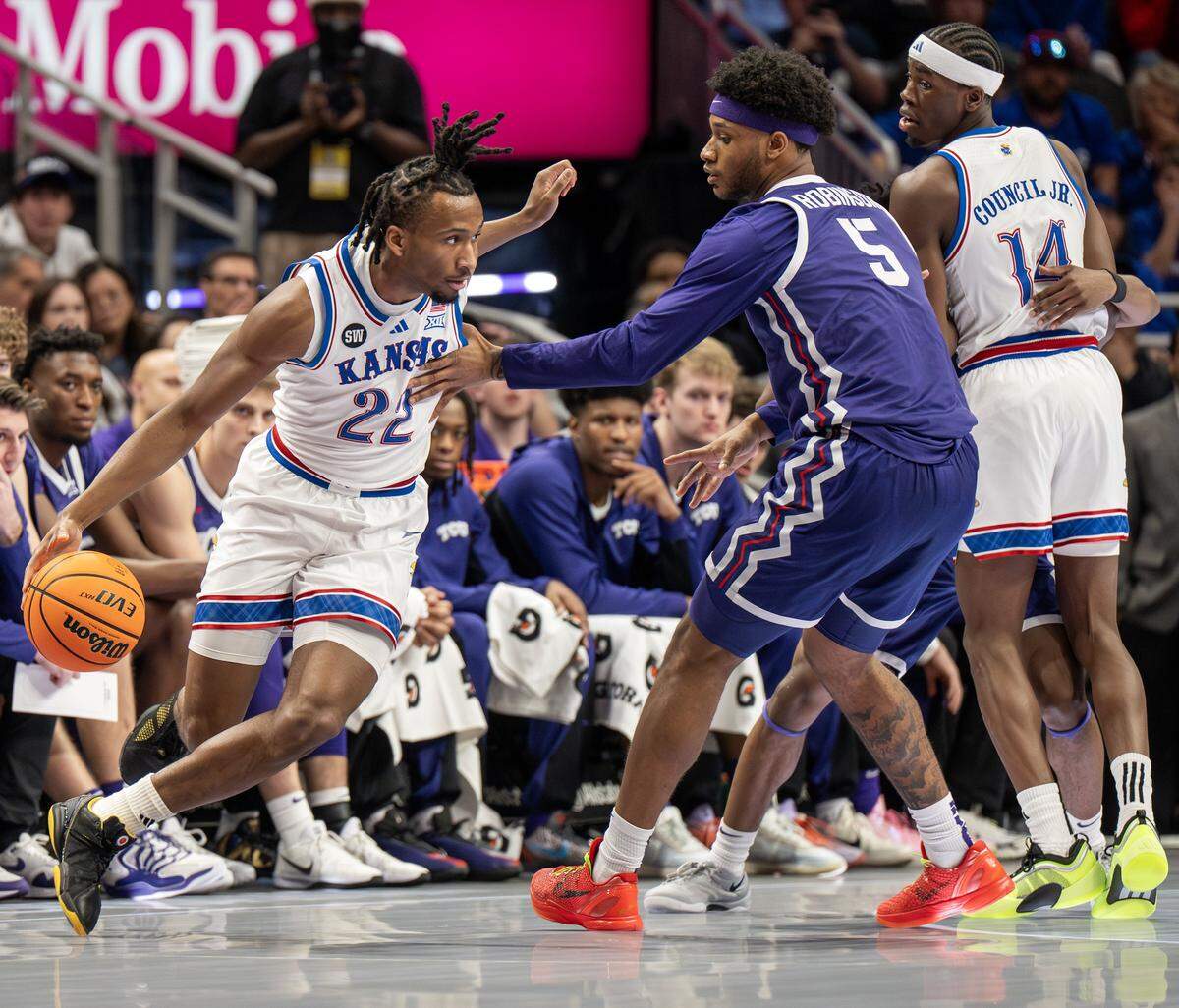 Kansas Jayhawks guard Darryn Peterson (22) dribbles the ball up court during the first half of a Big 12 Men's Basketball Tournament game against the Texas Christian University Horned Frogs at T-Mobile Center on Thursday, March 12, 2026, in Kansas City.