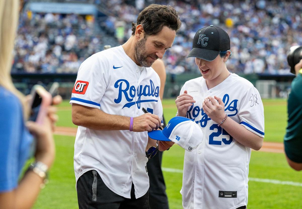 Paul Rudd signs an autograph after the Big Slick Celebrity Softball game on Friday, May 30, 2025, at Kauffman Stadium in Kansas City.