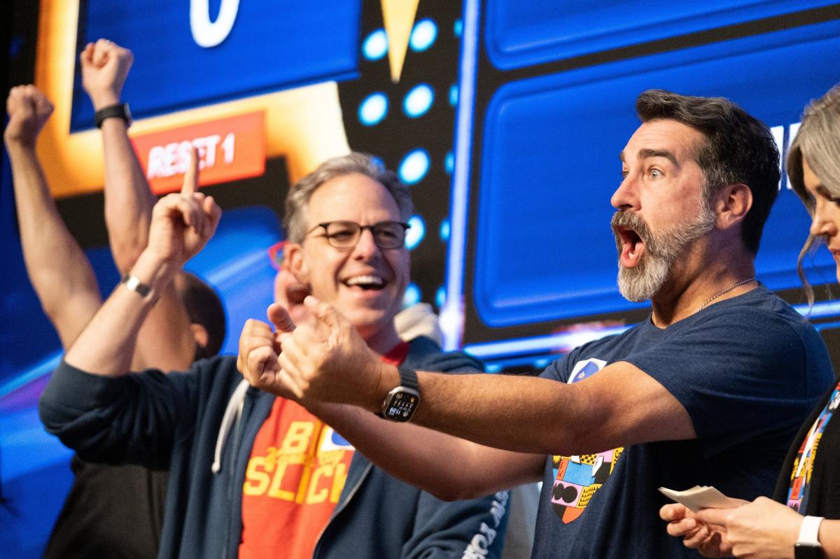Rob Riggle celebrates a correct answer during a round of Friendly Feud at the Big Slick Press Conference on Friday, May 31, 2024, at Children’s Mercy Research Institute.