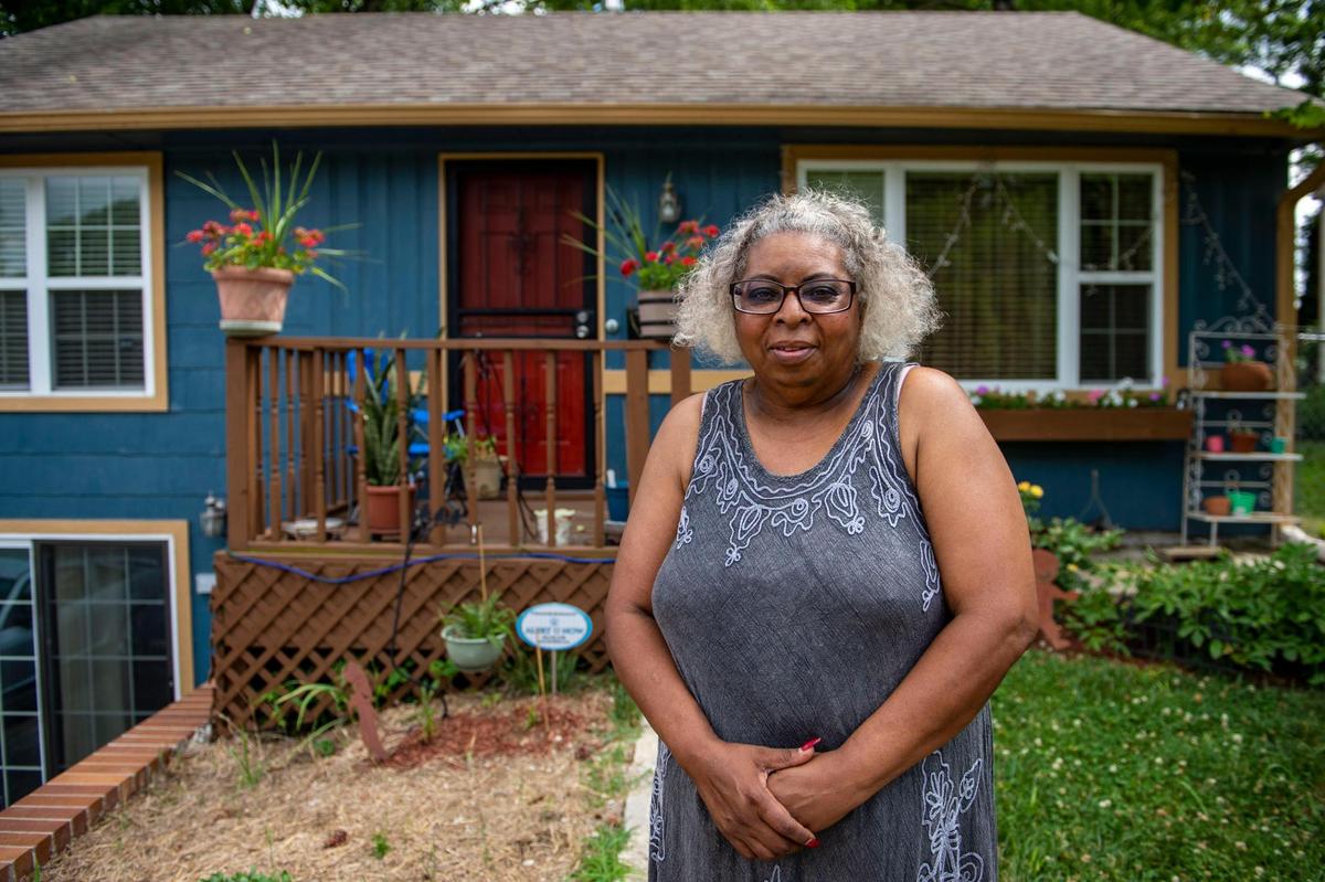 Eloise Franklin-Magitt stands in front of her home, Wednesday, June 23, 2021 in Kansas City. Franklin-Magitt says she doesn’t know if her property taxes this year will be above or below the estimated amount she got. In 2019 she saw her property tax go up around $100 and payed it off in three installments.