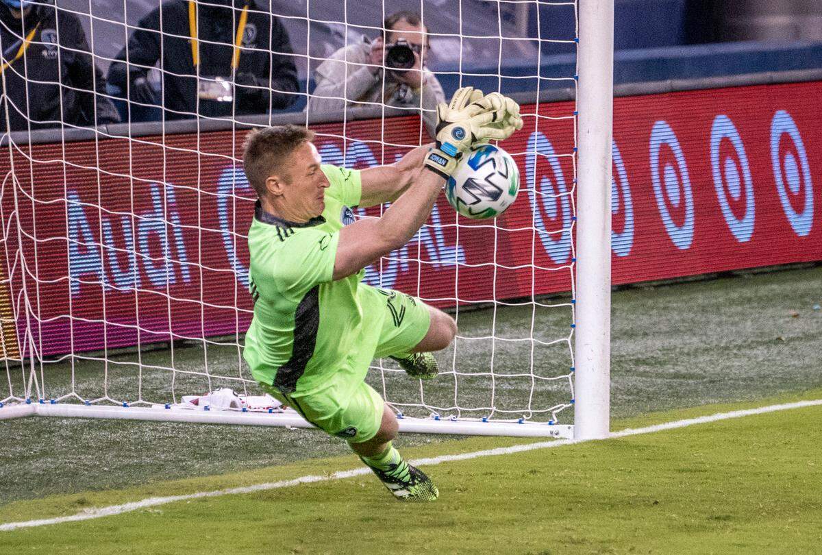 Sporting Kansas City goalkeeper Tim Melia (29) stops a shot during a penalty kick shootout against the San Jose Earthquakes at Children’s Mercy Park on Nov. 22, 2020.