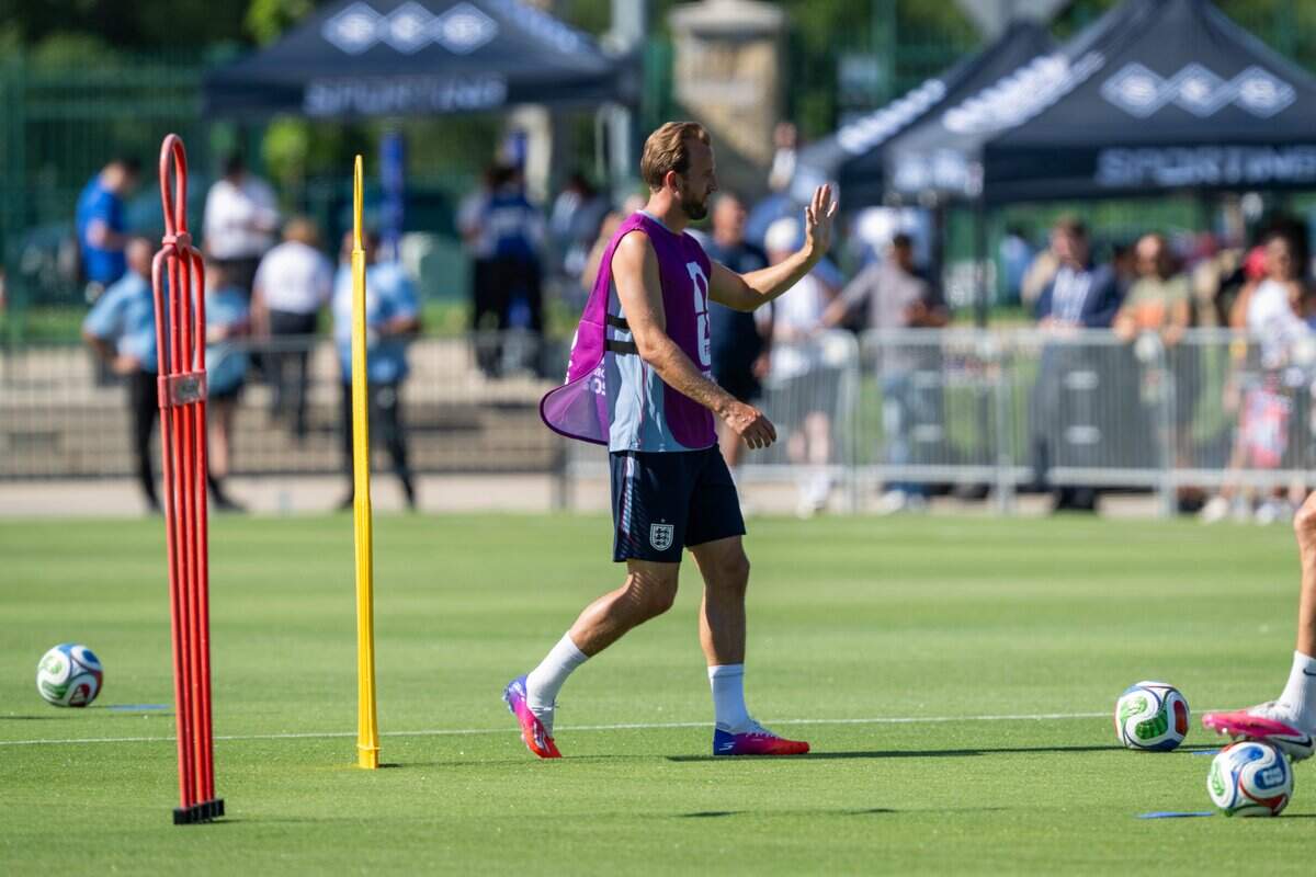 England's Harry Kane waves to fans during practice on Victory Field at Swope Soccer Village, Saturday, June 13, 2026, in Kansas City. The team will call Prairie Village home during the World Cup.