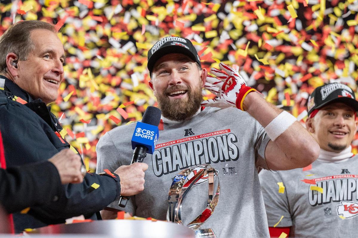 Kansas City Chiefs tight end Travis Kelce (87) cups his hand to his ear, riling up the crowd during the trophy ceremony after the Chiefs’ 32-29 victory over the Buffalo Bills in the AFC Championship Game on Sunday, Jan. 26, 2025, at GEHA Field at Arrowhead Stadium.