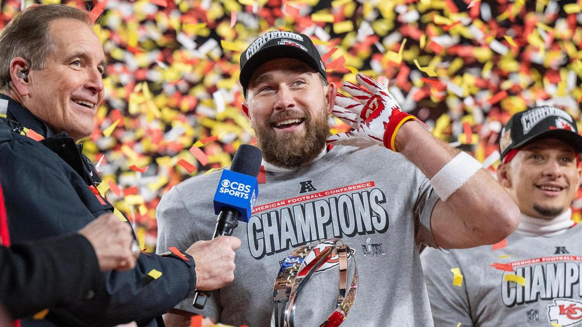 Kansas City Chiefs tight end Travis Kelce (87) cups his hand to his ear, riling up the crowd during the trophy ceremony after the Chiefs’ 32-29 victory over the Buffalo Bills in the AFC Championship Game on Sunday, Jan. 26, 2025, at GEHA Field at Arrowhead Stadium.