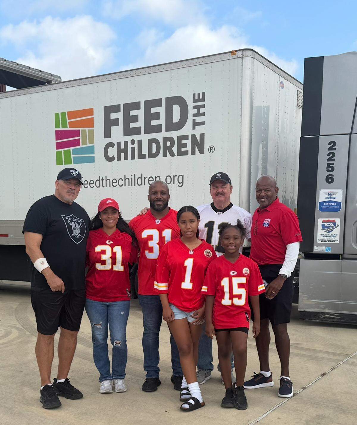 Volunteers, including Priest Holmes and other former NFL players, received supplies from Feed the Children of Tennessee last weekend to help with flood relief in central Texas.