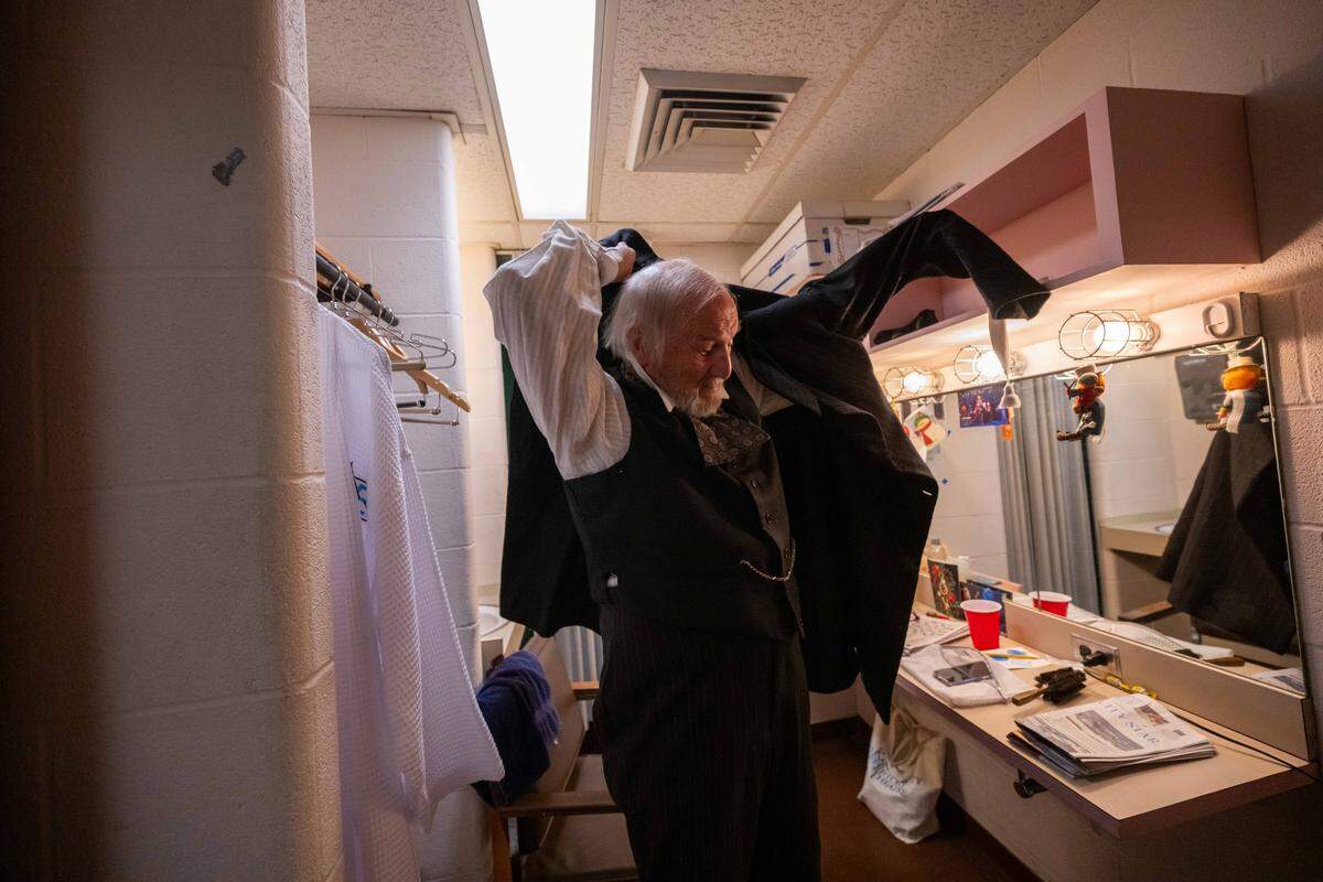 Gary Neal Johnson gets dressed in his costume to play Scrooge on Friday, December 19. A KC native, Johnson first joined the production more than 40 years ago, when he was 32 years old. 