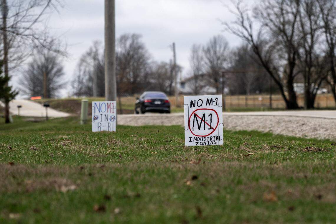 Picket signs are seen along 199th W. Street on Saturday, March 7, 2026, in Spring Hill, Kansas.