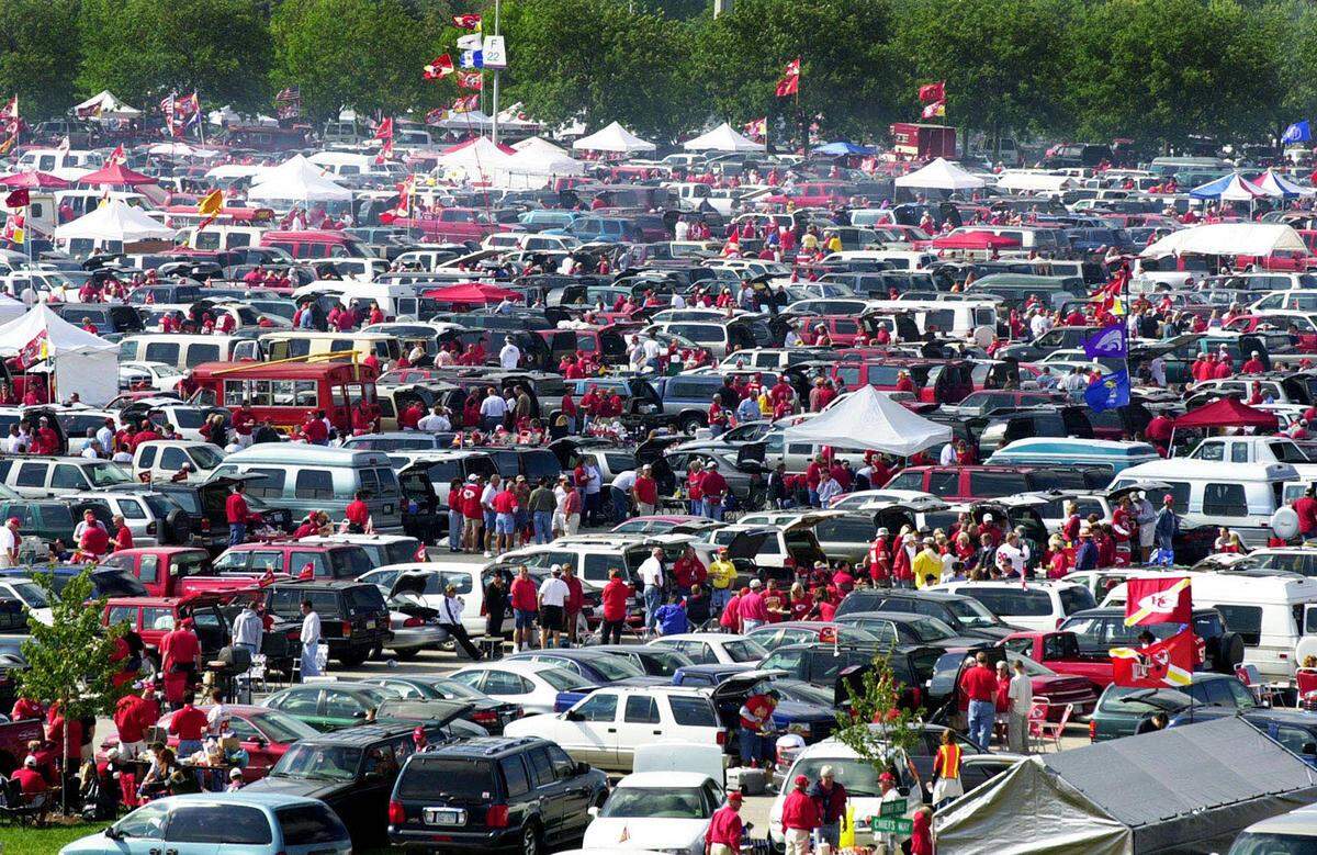 Tailgaters pack the parking lot surrounding Arrowhead Stadium before the start of a 2001 game between the Kansas City Chiefs and Oakland Raiders.