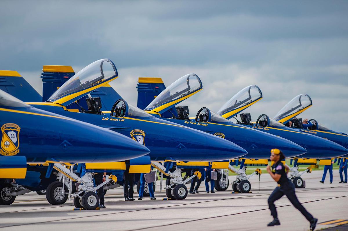 The U.S. Navy Blue Angels lined up on the tarmac after arriving Thursday, July 1, at the New Century AirCenter in Gardner, Kansas, in preparation for the 2021 KC Air Show on Saturday and Sunday. A member of the maintence team rushed out to the plance. The elite group of pilots will perform over the weekend. Last year’s air show was canceled due to the pandemic.