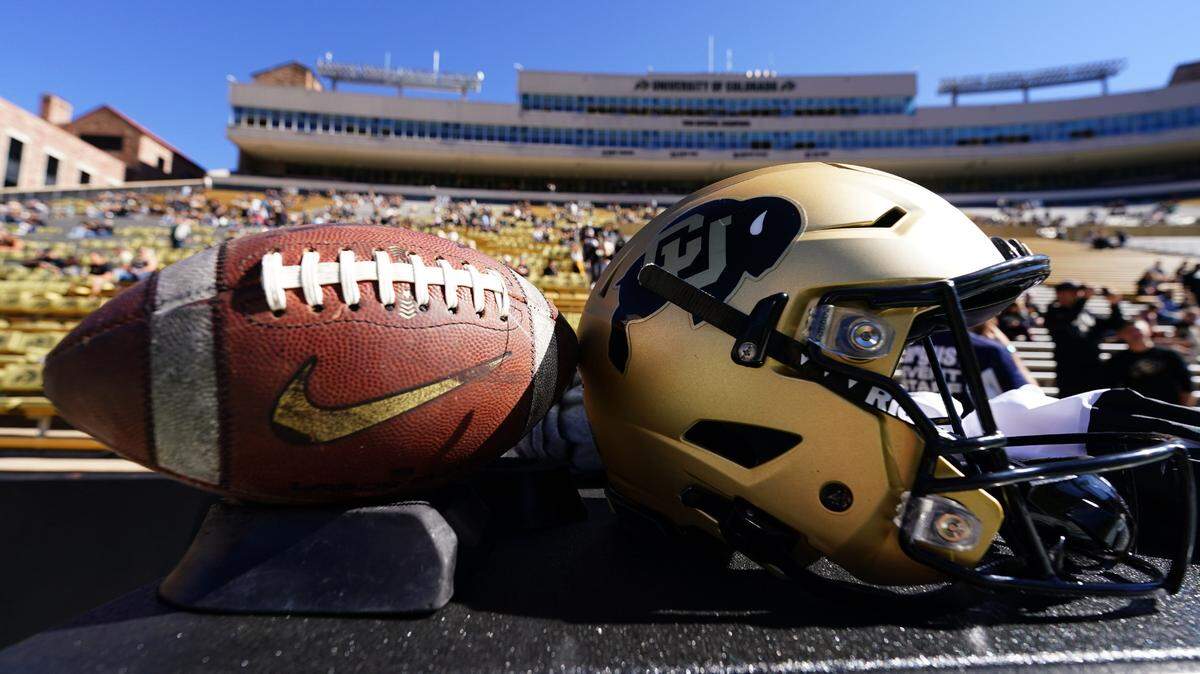 General view of a Colorado Buffaloes helmet and football before the game against the Arizona Wildcats at Folsom Field.