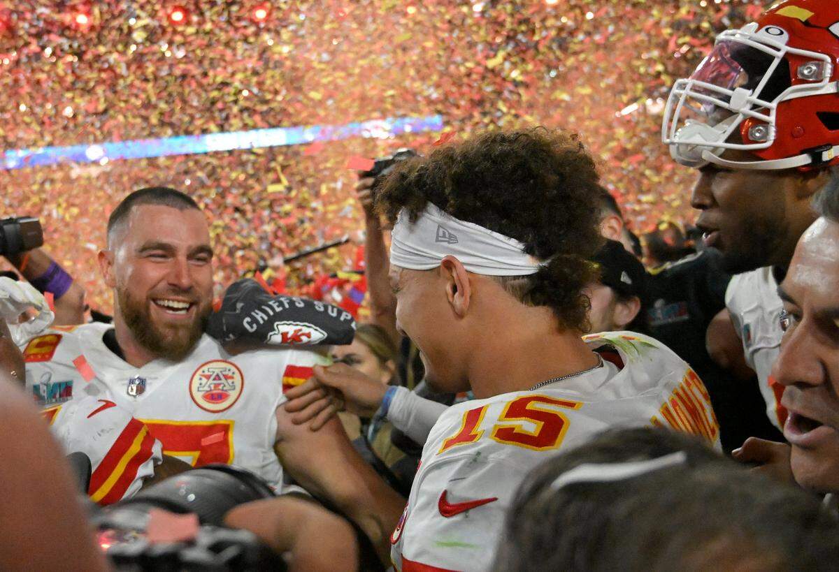 Kansas City Chiefs tight end Travis Kelce (87) celebrated with Kansas City Chiefs quarterback Patrick Mahomes (15) on the field after defeating the Eagles, 38-35, to win Super Bowl LVII on Sunday, Feb. 12, 2023, at State Farm Stadium in Glendale, Arizona.