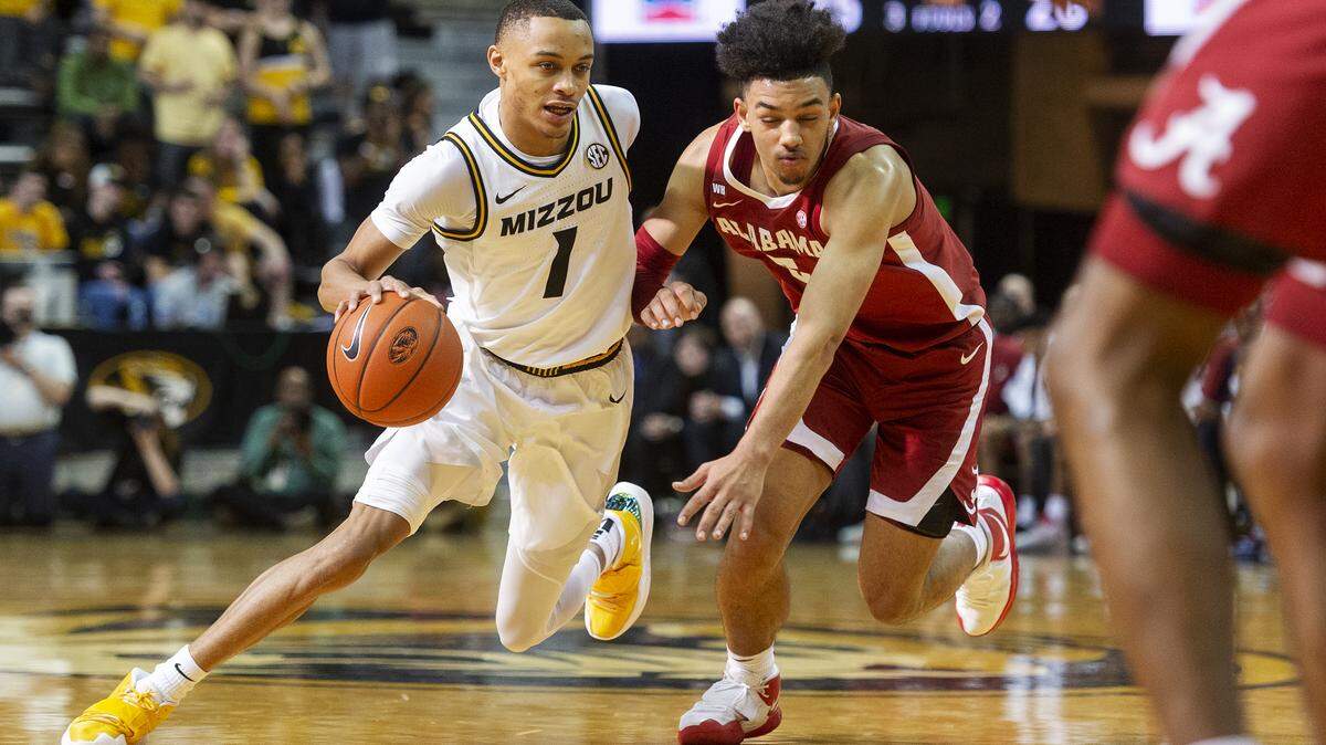 Missouri’s Xavier Pinson, left, dribbles past Alabama’s Jaden Shackelford, right, during the second half of an NCAA college basketball game Saturday, March 7, 2020, in Columbia, Mo. Missouri won 69-50.(AP Photo/L.G. Patterson)