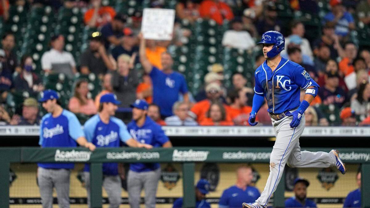 Kansas City Royals’ Whit Merrifield runs toward home plate after hitting a grand slam against the Houston Astros during the seventh inning of a baseball game Wednesday, Aug. 25, 2021, in Houston. (AP Photo/David J. Phillip)