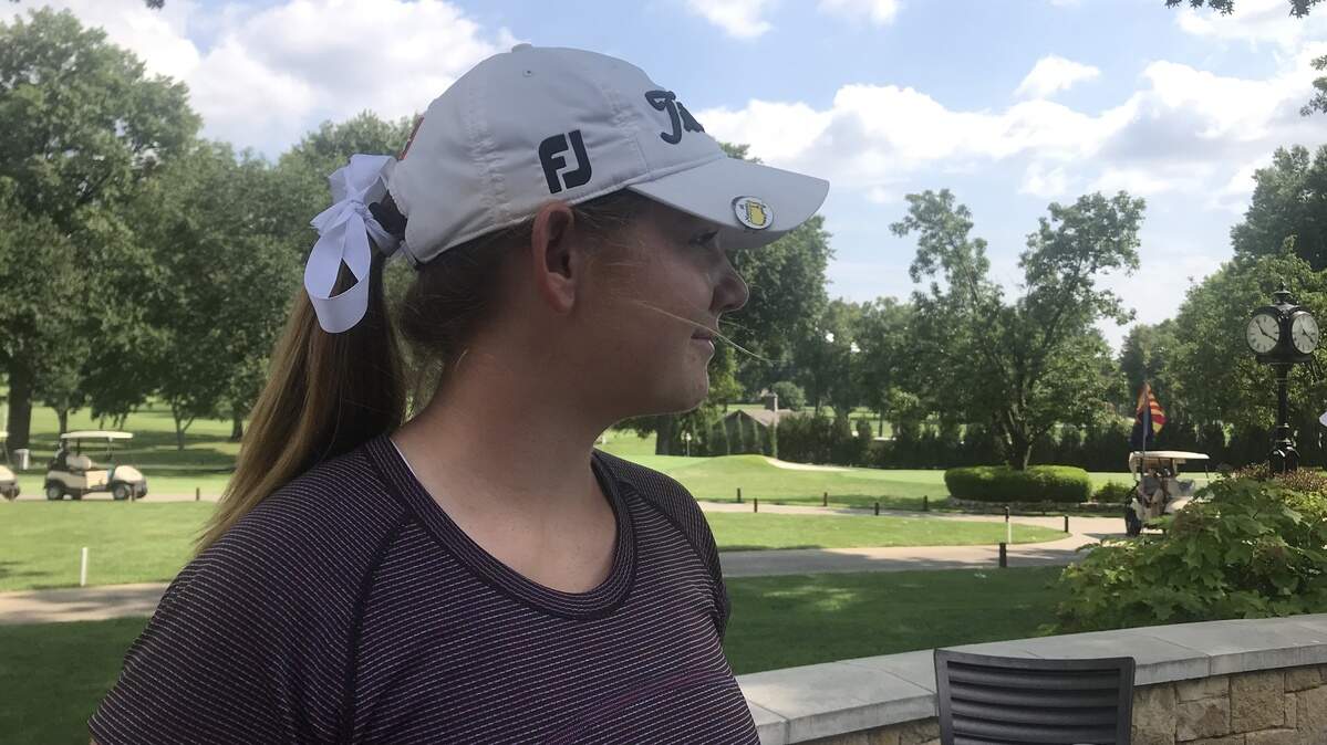 Fourteen-year-old Reagan Zibilski overlooks the Indian Hills Country Club where she sits in first place after first day of competition.