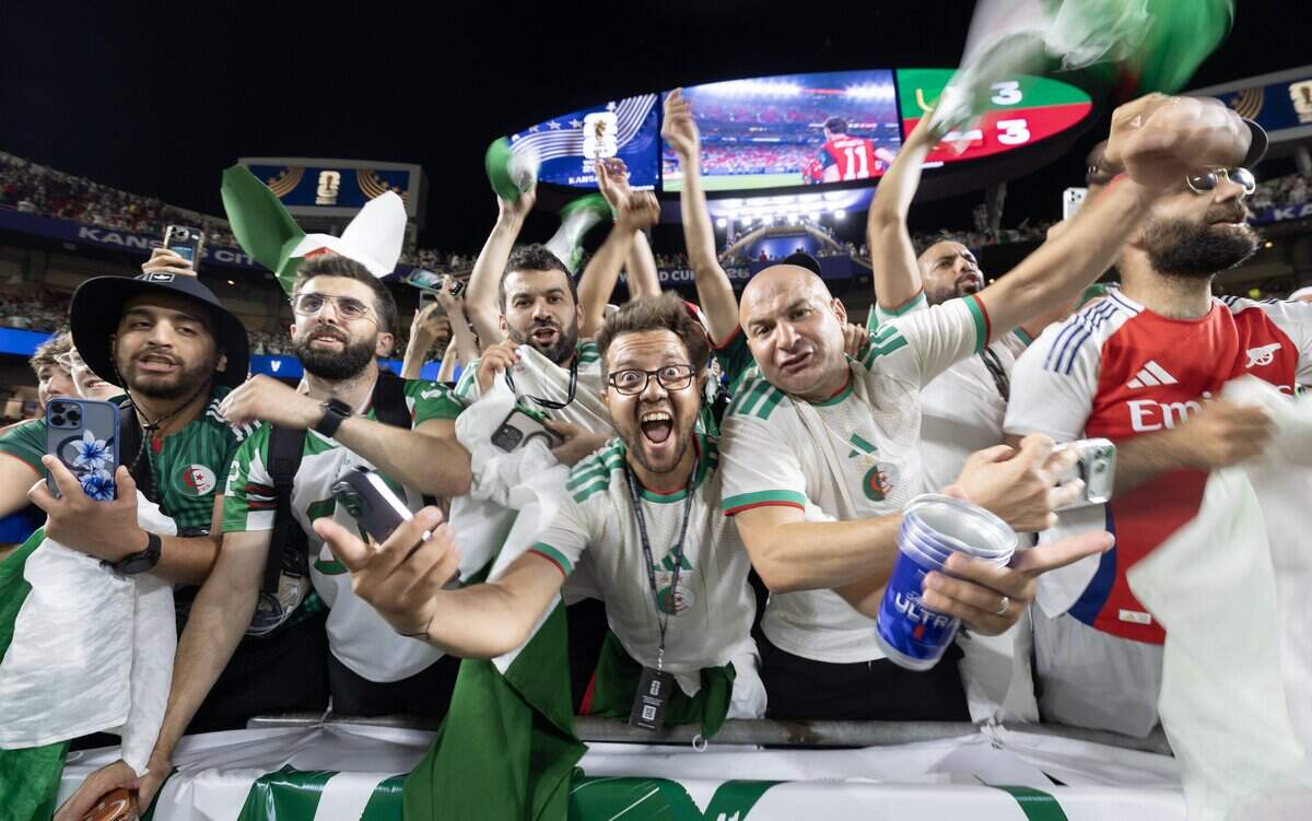 Algerian fans celebrate their team's draw against Austria to advance to the round of 32 after a FIFA World Cup group-stage soccer match at Kansas City (Arrowhead) Stadium in Kansas City on Saturday, June 27, 2026.
