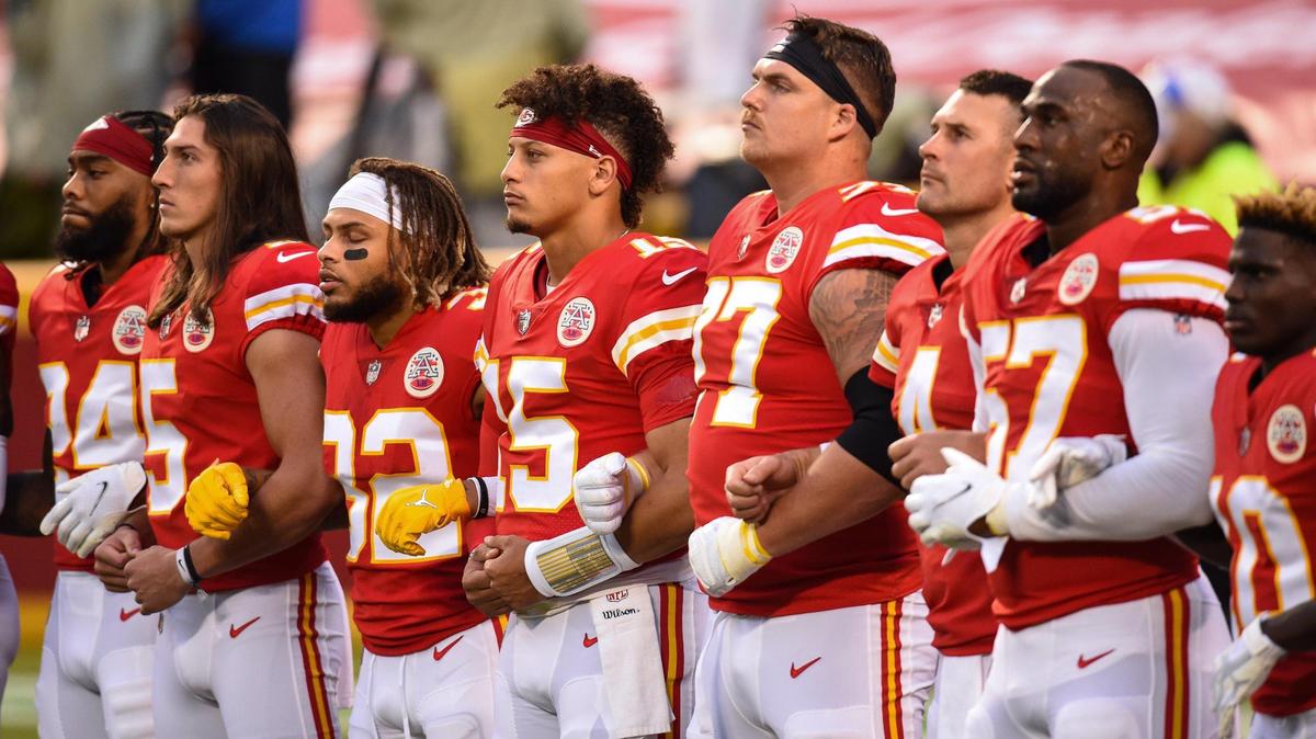 Members of the Kansas City Chiefs locked arms and stood for the playing of “Lift Every Voice and Sing,” a song considered by many as the Black national anthem, during pregame ceremonies Thursday at the NFL season opener with the Houston Texans at Arrowhead Stadium.