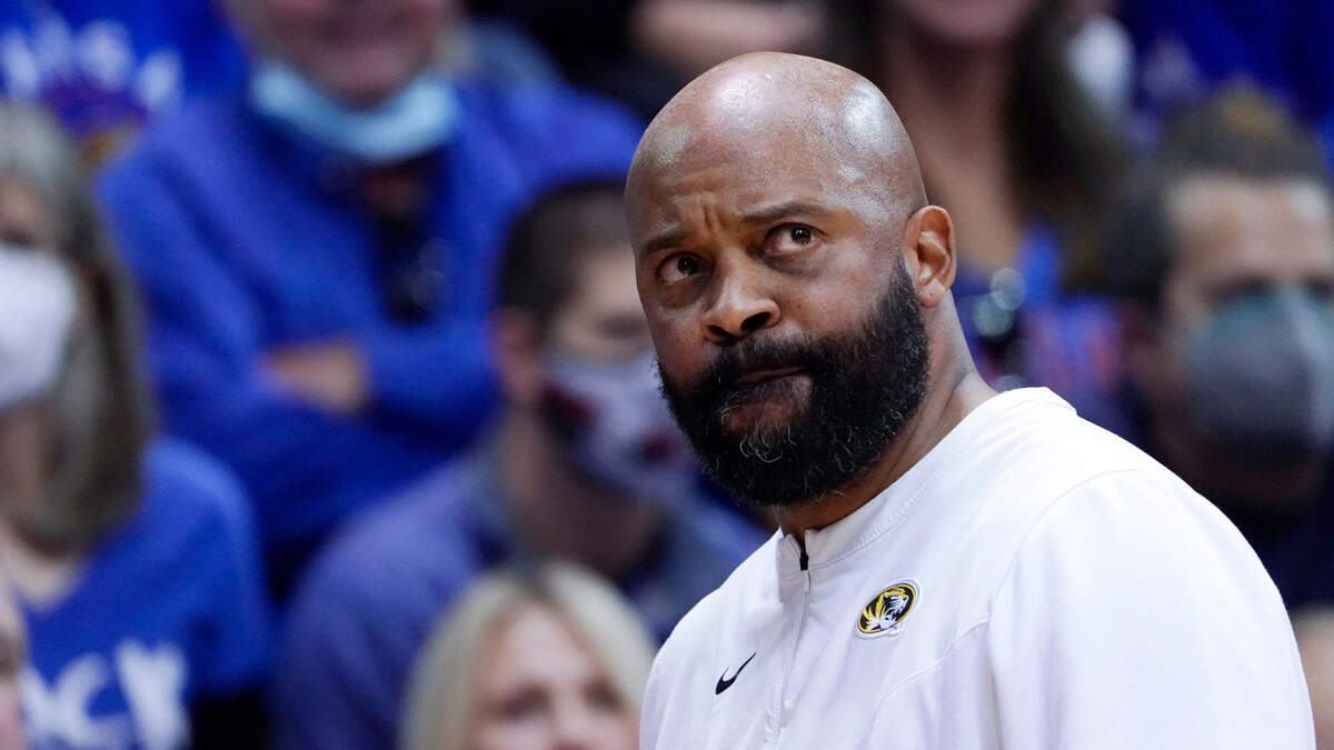 Missouri head coach Cuonzo Martin looks up at the scoreboard in the first half of an NCAA college basketball game against Kansas, Saturday, Dec. 11, 2021, in Lawrence, Kan. Kansas won 102-65. (AP Photo/Ed Zurga)